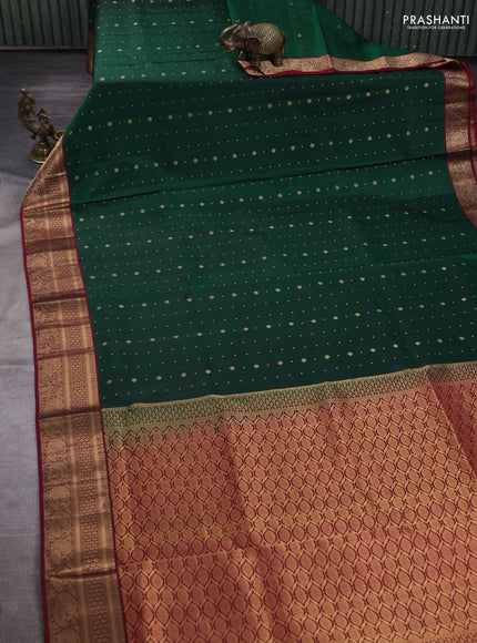 Pure soft silk saree bottle green and deep maroon with allover zari woven buttas and zari woven border