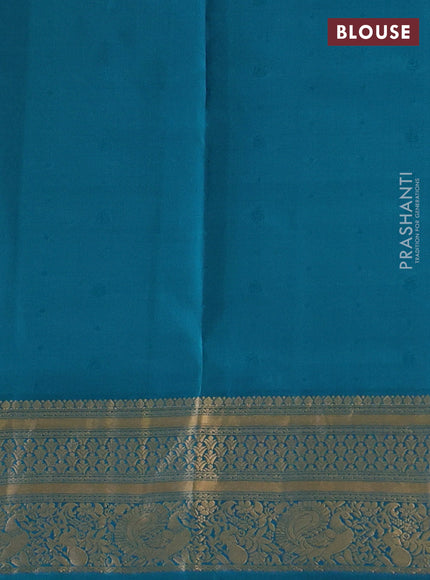 Pure soft silk saree dual shade of pinkish orange and teal green with allover zari woven buttas and zari woven border
