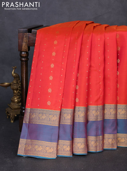 Pure soft silk saree orange and teal blue with allover zari woven buttas and rettapet zari woven border