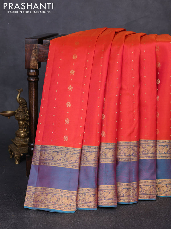 Pure soft silk saree orange and teal blue with allover zari woven buttas and rettapet zari woven border