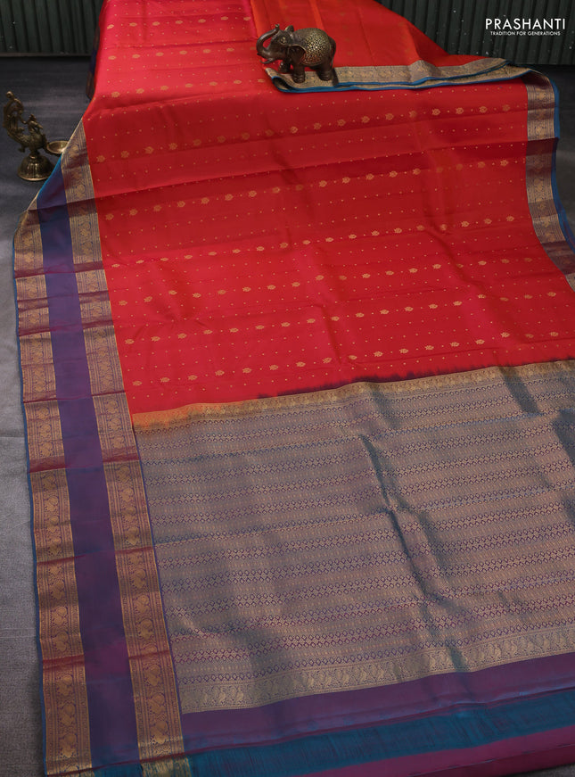 Pure soft silk saree orange and teal blue with allover zari woven buttas and rettapet zari woven border