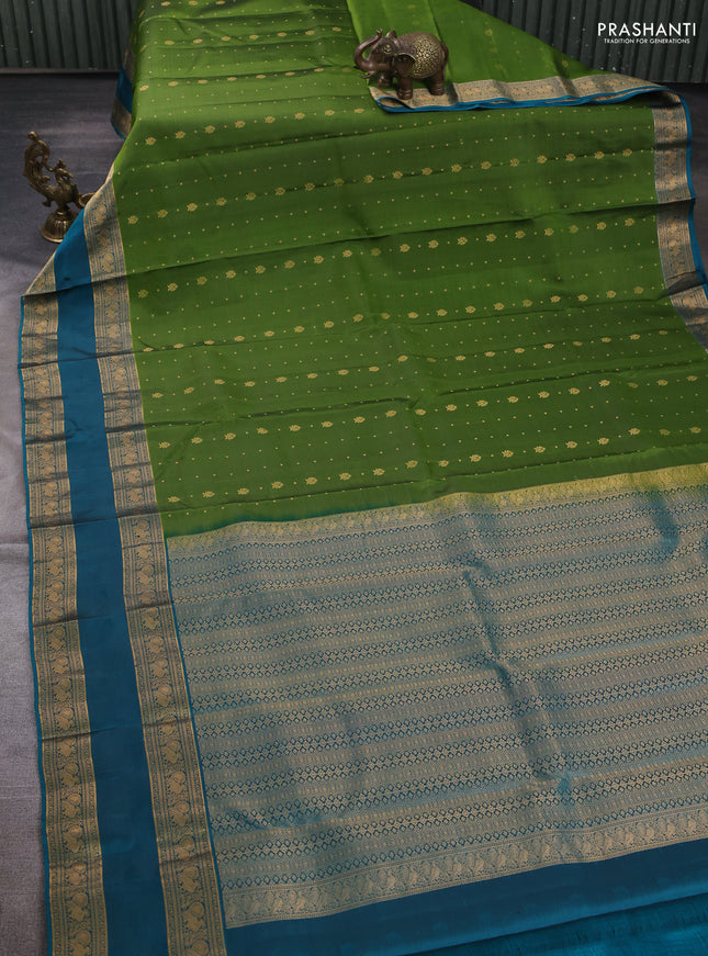 Pure soft silk saree light green and teal blue with allover zari woven buttas and rettapet zari woven border