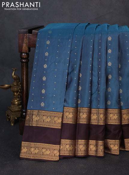 Pure soft silk saree peacock blue shade and coffee brown with allover zari woven buttas and rettapet zari woven border