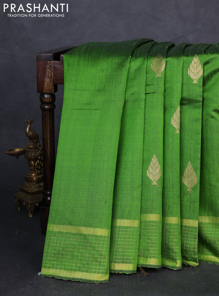Pure dupion silk saree light green with zari woven buttas and zari woven checked border