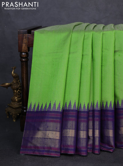 Pure dupion silk saree light green and navy blue with plain body and temple design zari woven border