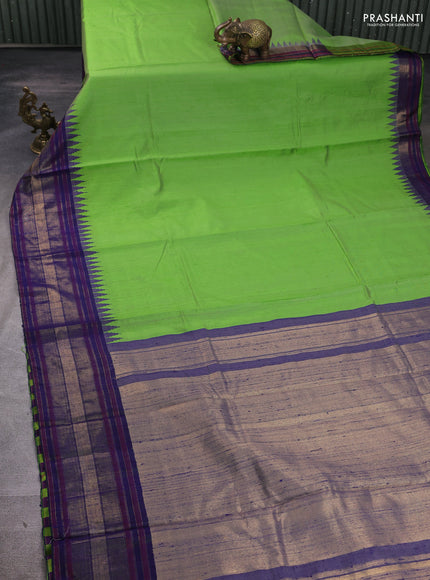 Pure dupion silk saree light green and navy blue with plain body and temple design zari woven border
