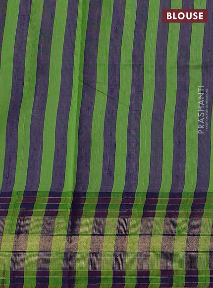 Pure dupion silk saree light green and navy blue with plain body and temple design zari woven border