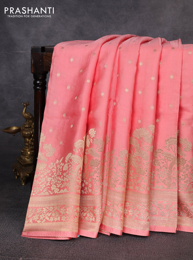 Banarasi silk saree peach shade with allover floral zari woven buttas and long zari woven border