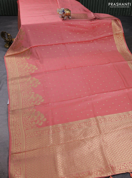 Banarasi silk saree peach shade with allover floral zari woven buttas and long zari woven border