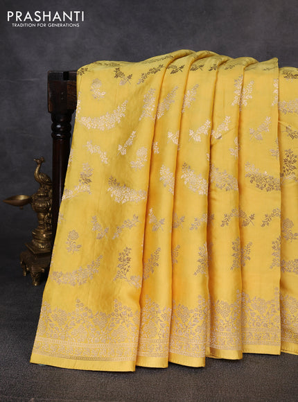 Banarasi silk saree yellow shade with allover zari weaves and zari woven border