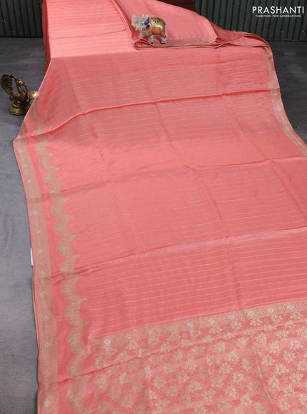 Banarasi silk saree peach orange with allover zari stripe pattern and zari woven border