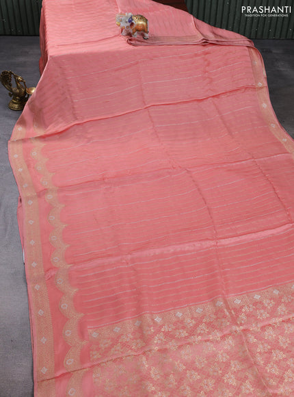 Banarasi silk saree peach shade with allover zari stripe pattern and zari woven border