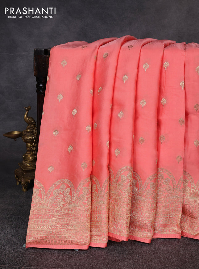 Banarasi silk saree peach shade with allover zari woven buttas and zari woven border
