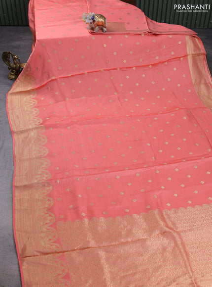 Banarasi silk saree peach shade with allover zari woven buttas and zari woven border