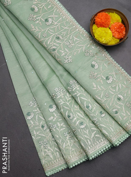 Semi Chanderi Saree pastel green with allover mirror embroidery buttas and corsha lace work border