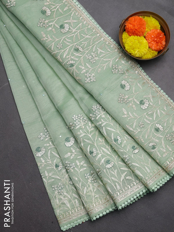 Semi Chanderi Saree pastel green with allover mirror embroidery buttas and corsha lace work border