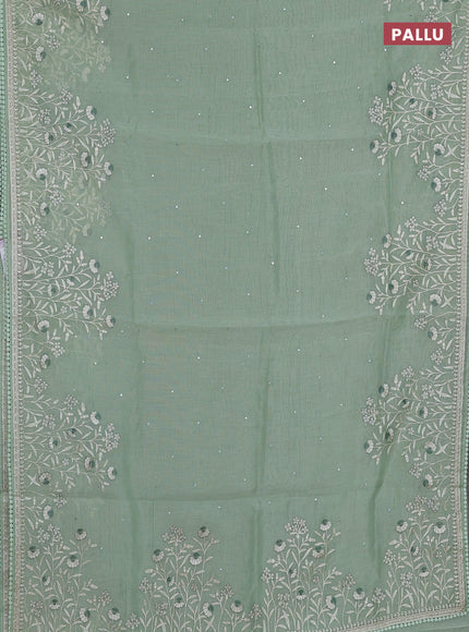 Semi Chanderi Saree pastel green with allover mirror embroidery buttas and corsha lace work border