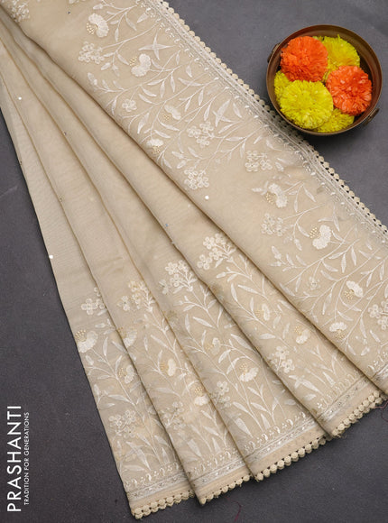 Semi Chanderi Saree beige with allover mirror embroidery buttas and corsha lace work border