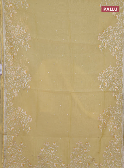 Semi Chanderi Saree pale yellow with allover mirror embroidery buttas and corsha lace work border