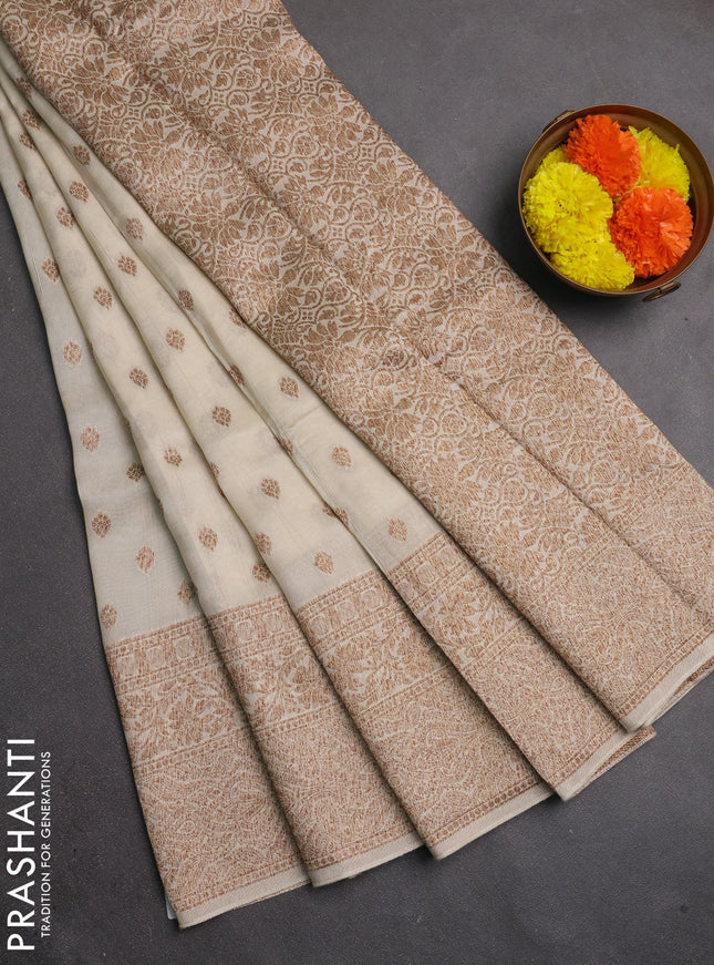 Banarasi semi raw silk saree cream with allover thread & zari woven buttas and long woven border