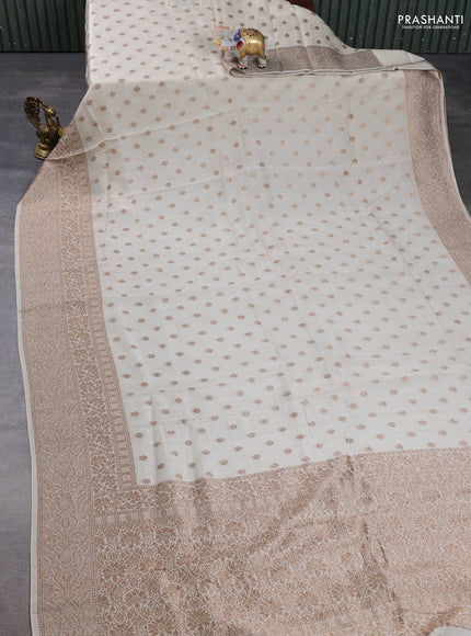 Banarasi semi raw silk saree cream with allover thread & zari woven buttas and long woven border