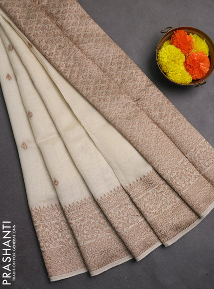 Banarasi semi raw silk saree off white with allover thread & zari woven buttas and woven border
