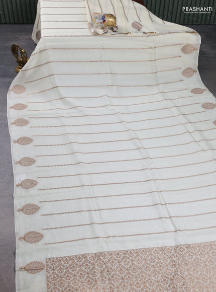 Banarasi semi raw silk saree cream with allover thread & zari woven weaves and woven butta border