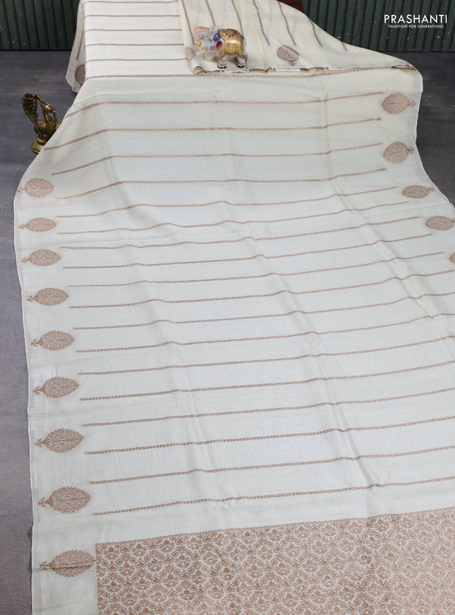 Banarasi semi raw silk saree cream with allover thread & zari woven weaves and woven butta border