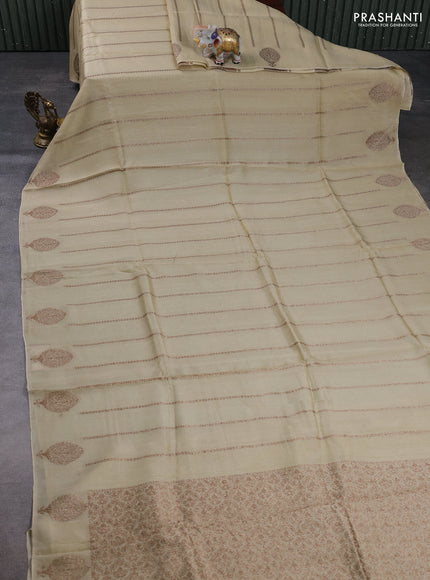Banarasi semi raw silk saree beige with allover thread & zari woven weaves and woven butta border