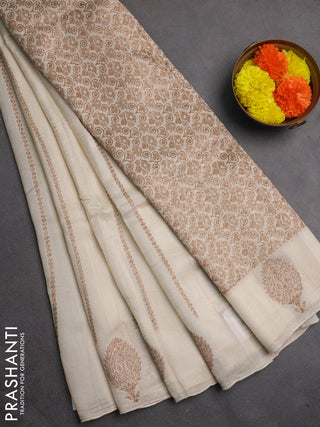 Banarasi semi raw silk saree off white with allover thread & zari woven weaves and woven butta border