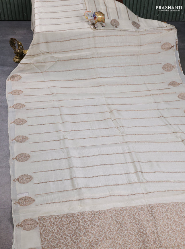 Banarasi semi raw silk saree off white with allover thread & zari woven weaves and woven butta border
