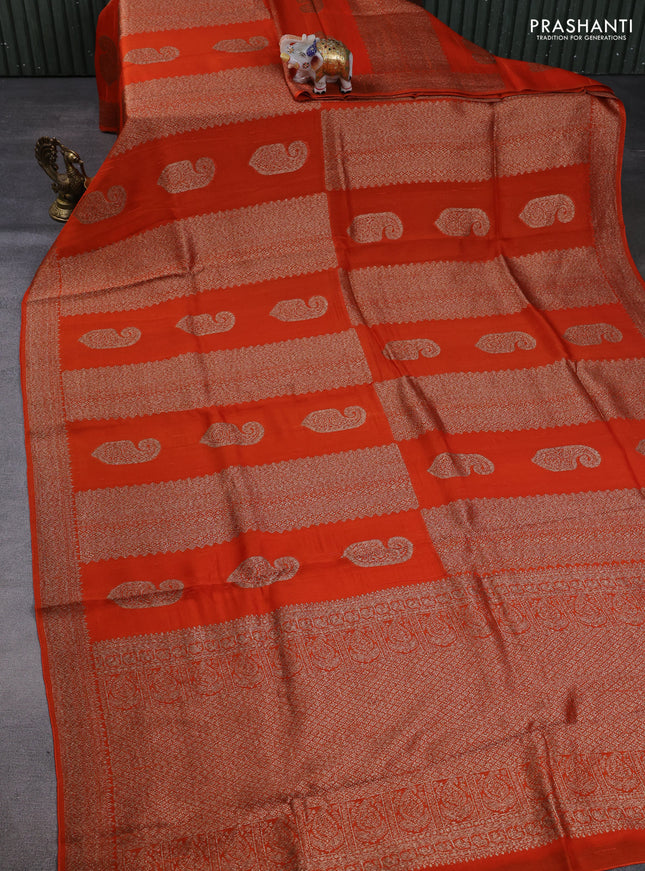 Banarasi semi raw silk saree orange with allover thread & zari weaves & buttas and woven border