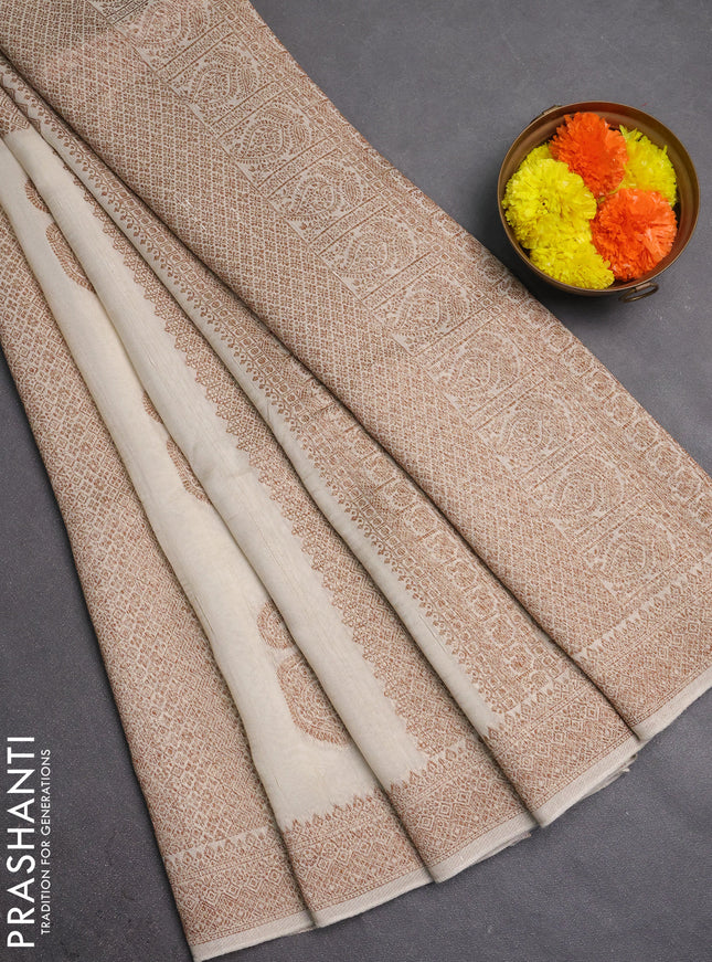 Banarasi semi raw silk saree cream with allover thread & zari weaves & buttas and woven border