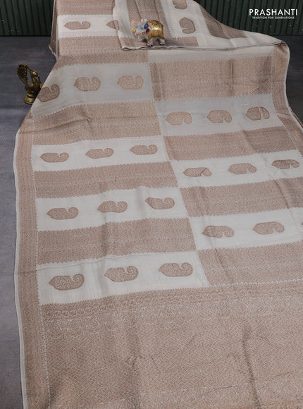 Banarasi semi raw silk saree cream with allover thread & zari weaves & buttas and woven border