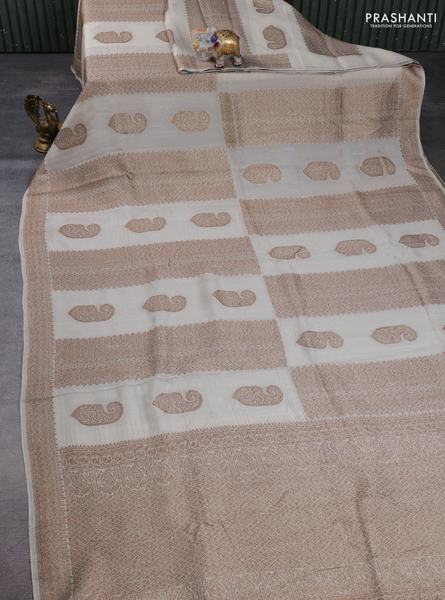 Banarasi semi raw silk saree cream with allover thread & zari weaves & buttas and woven border