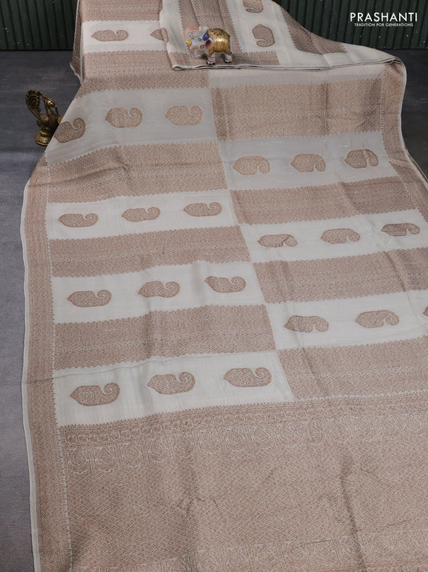 Banarasi semi raw silk saree cream with allover thread & zari weaves & buttas and woven border