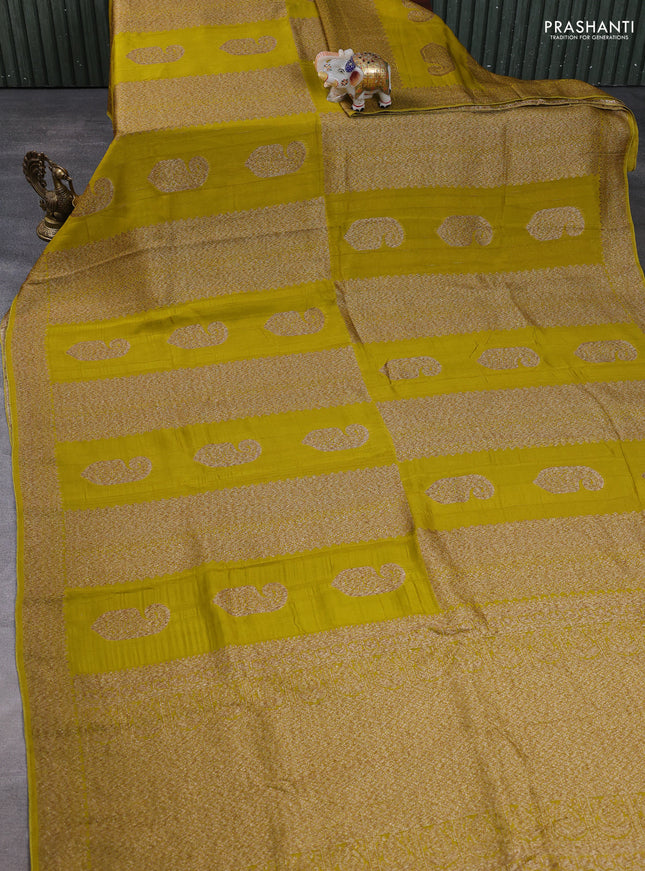 Banarasi semi raw silk saree mustard green with allover thread & zari weaves & buttas and woven border