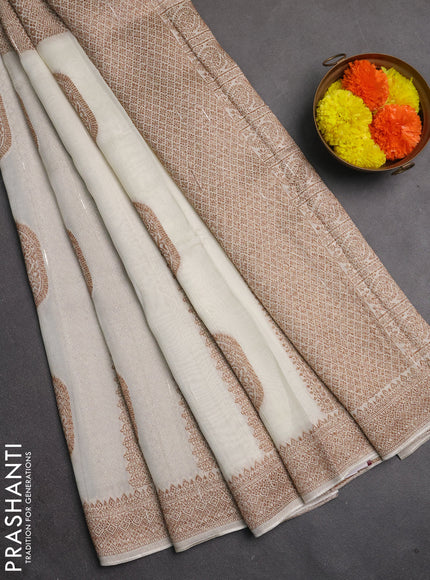 Banarasi semi raw silk saree cream with allover thread & zari weaves & buttas and woven border