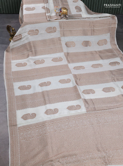 Banarasi semi raw silk saree cream with allover thread & zari weaves & buttas and woven border
