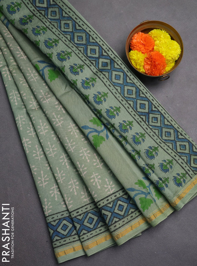 Chanderi bagru saree pastel green with allover batik prints and zari woven border