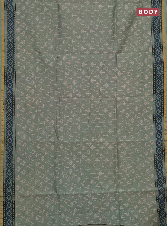 Chanderi bagru saree pastel green with allover batik prints and zari woven border