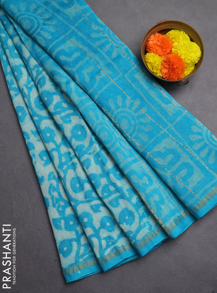 Chanderi bagru saree teal green with allover batik prints and zari woven border