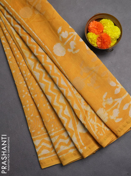 Chanderi bagru saree mustard yellow with allover dabu prints and zari woven border