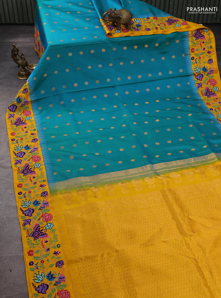 Pure gadwal silk saree dual shade of bluish green and yellow with allover zari woven buttas and temple design convent embroidery