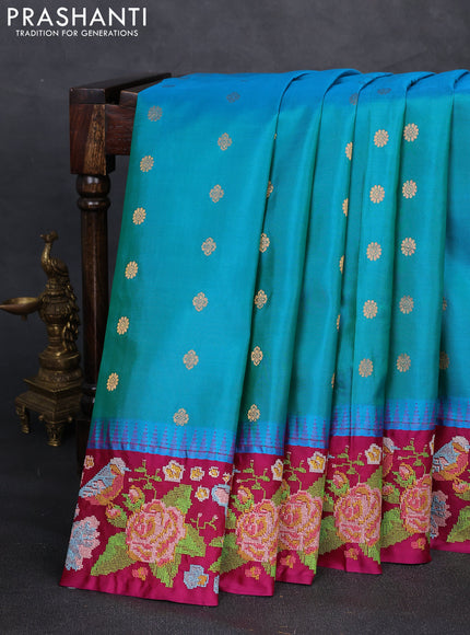 Pure gadwal silk saree dual shade of bluish green and magenta pink with allover zari woven buttas and temple design convent embroidery