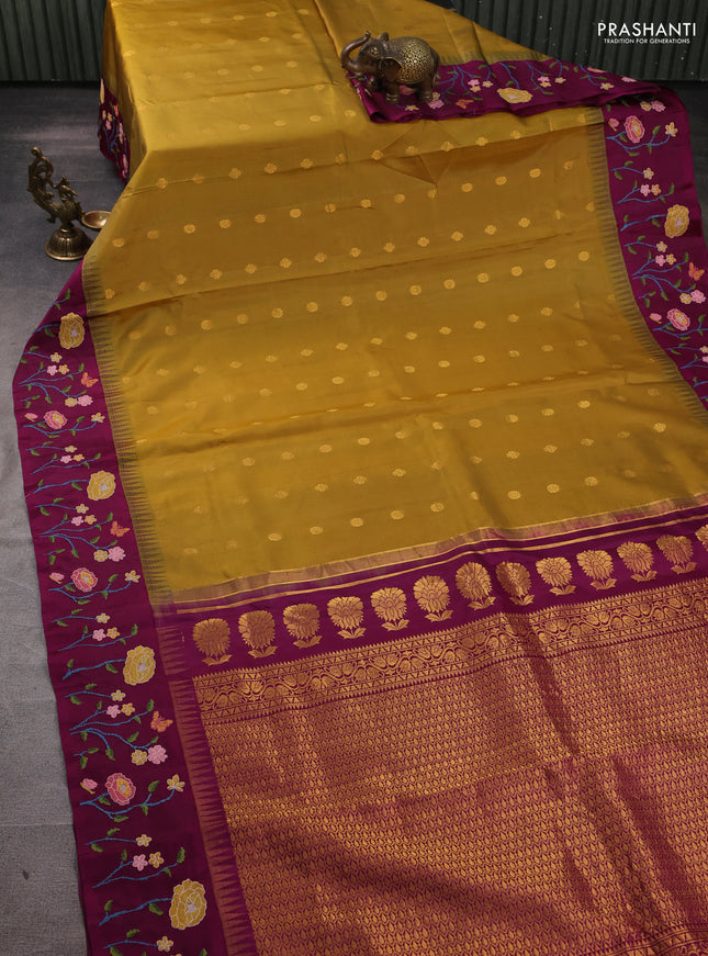 Pure gadwal silk saree dark mustard and purple with allover zari woven buttas and temple design convent embroidery