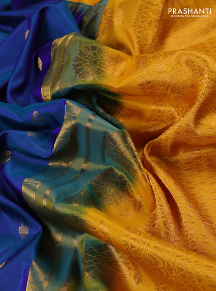 Pure gadwal silk saree dual shade of bluish green and mango yellow with allover zari woven buttas and temple design convent embroidery