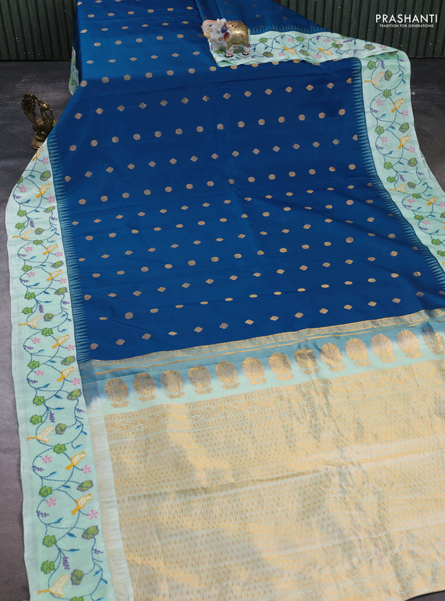 Pure gadwal silk saree peacock blue and pista green with allover zari woven buttas and temple design convent embroidery