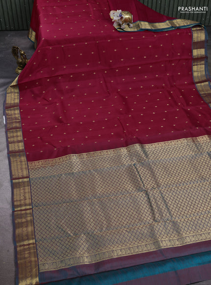 Kanchipuram silk saree reddish pink and teal green with allover zari woven buttas and zari woven border