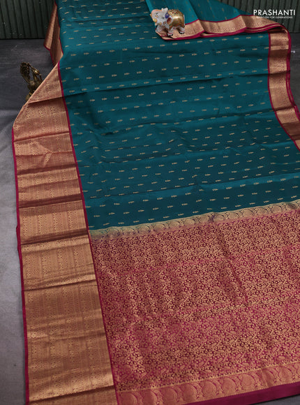 Kanchipuram silk saree peacock green and magenta pink with allover zari woven buttas and long zari woven border